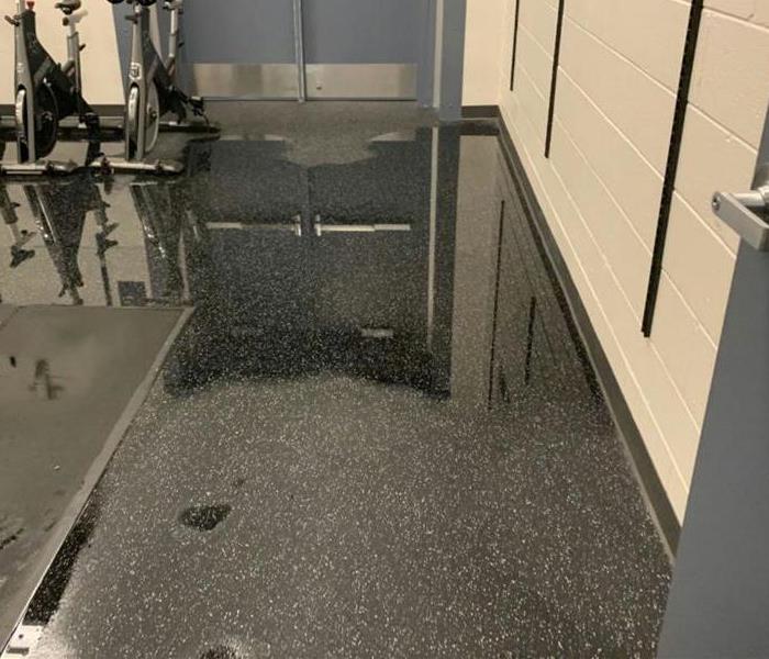 Water on floor of gym at Nederland High School